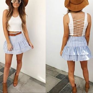 Hope’s white open back crop top